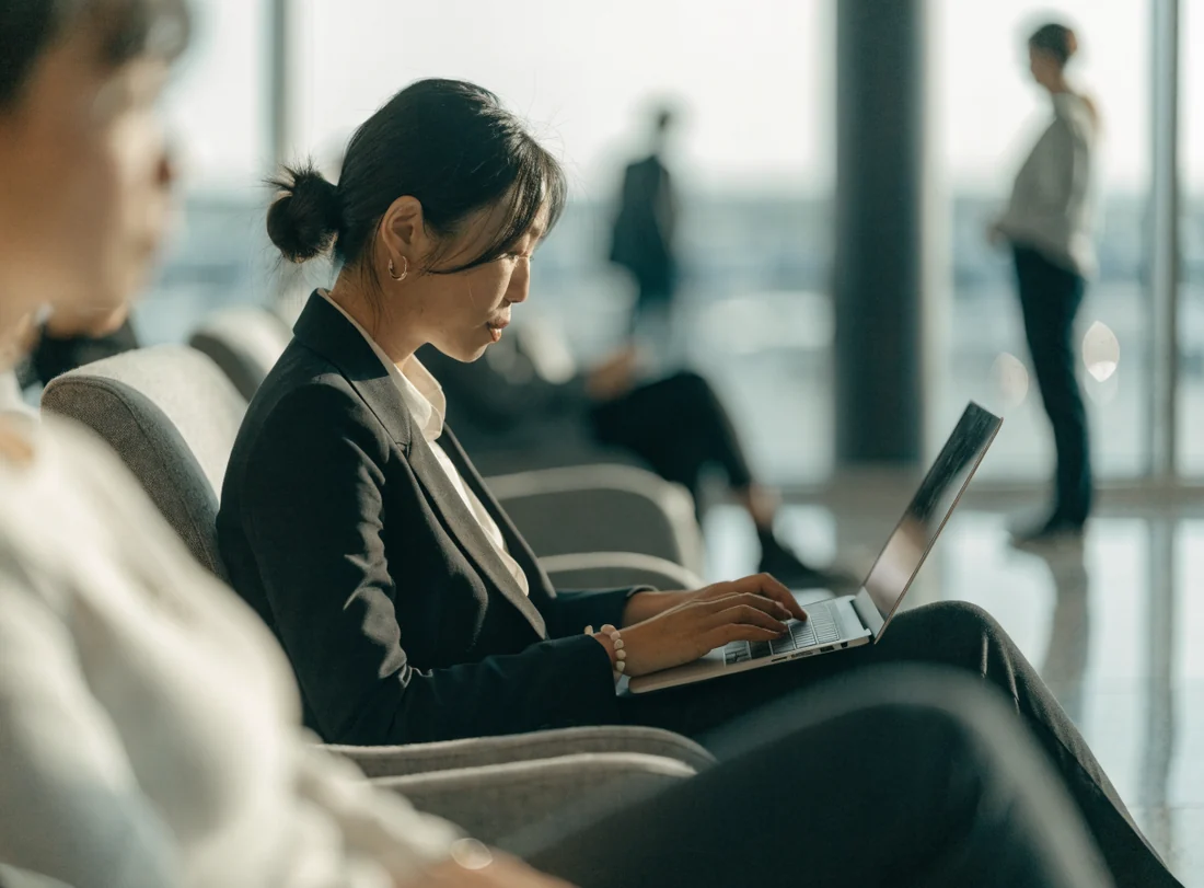 Business traveller working in an airport lounge